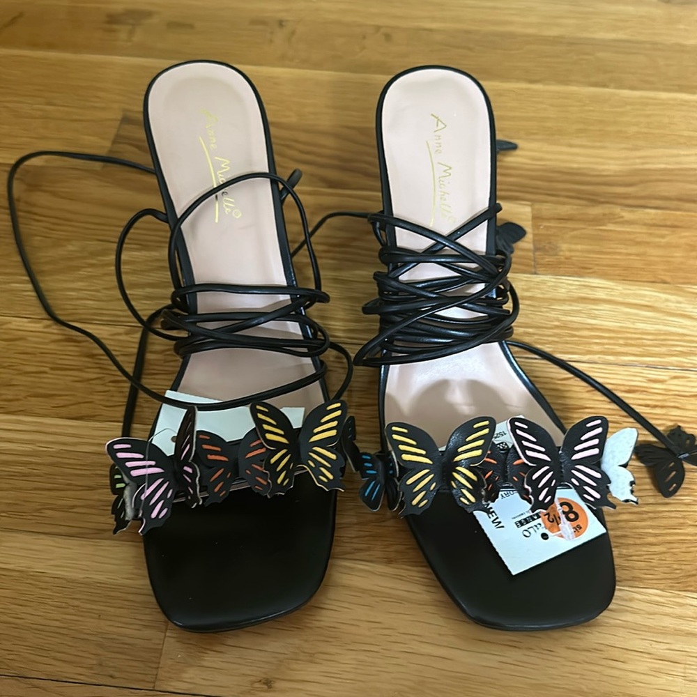 Black butterfly heels that tie around calf. Size 8.5